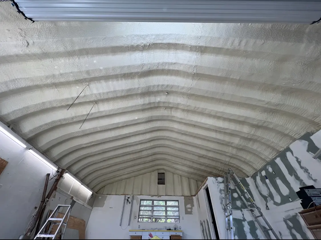 Spray polyurethane foam applied to the underside of a metal roof deck in Bremen